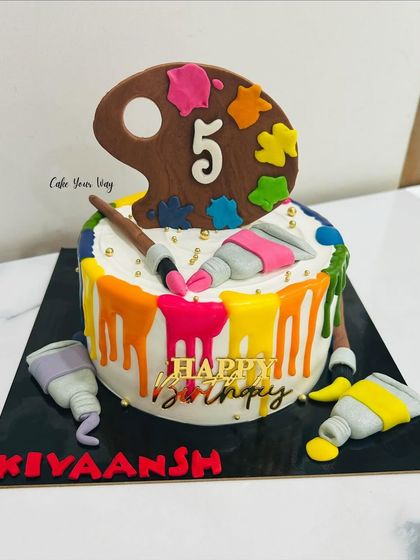 Sweet strokes of joy for a little artist. This colorful paint-palette drip cake is perfect for a creative 5th birthday.