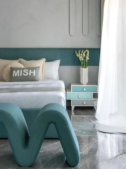 Another angle of the kids' bedroom, showing the wavy, custom-designed bench at the foot of the bed. The playful shapes and soothing colors create a space that is both fun and restful.