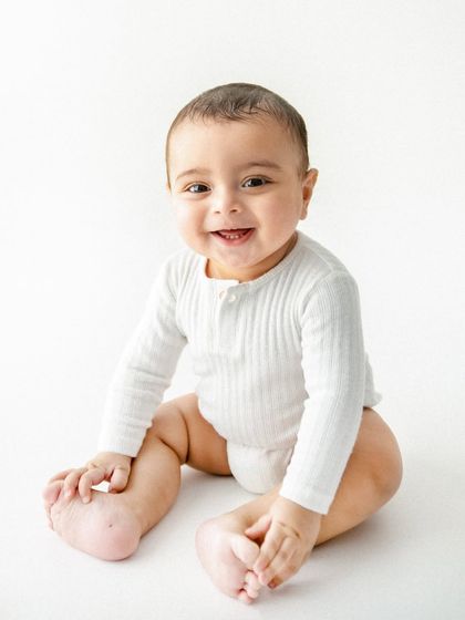 The same infectious smile, just a slightly different angle. I always take a variety of shots to ensure we capture that one perfect expression you’ll want to frame.