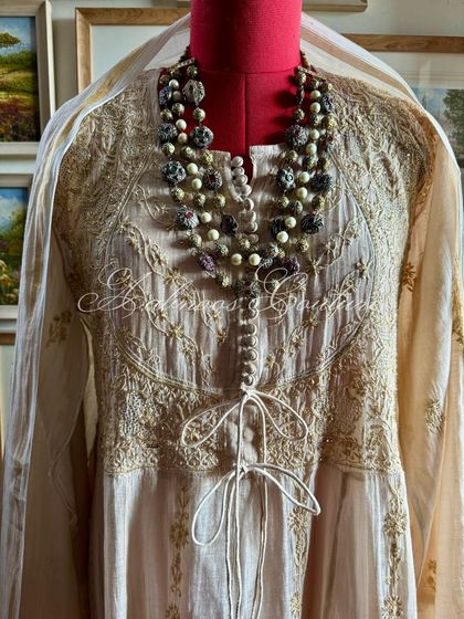 Another close-up of the neckline, demonstrating the rich detail of the hand-embroidery.