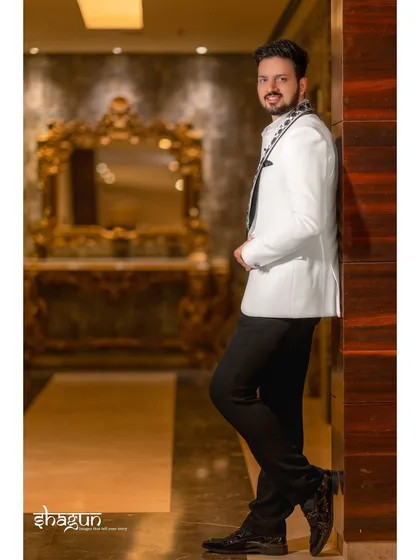 The groom, looking sharp and confident. I make sure our heroes get their own stylish portraits, capturing their personality before the big moments.