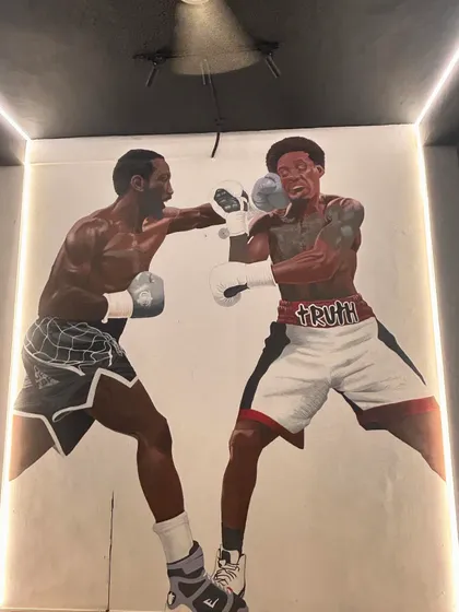 The walls of our gym are decorated with legends like Crawford and Spence. We surround ourselves with inspiration to fuel our own journey to greatness. This is the vibe of Champions Corner 2.0.