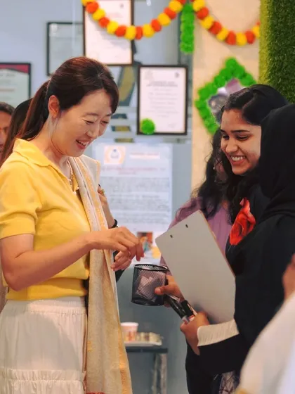 A candid moment of cultural exchange and friendship during our Onam celebrations. We encourage students to interact and practice their language skills in real, everyday situations.
