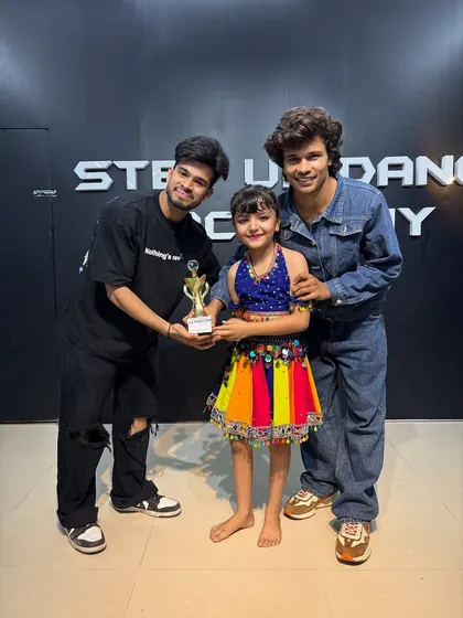 A young winner in her colorful costume. We nurture talent from a very young age.