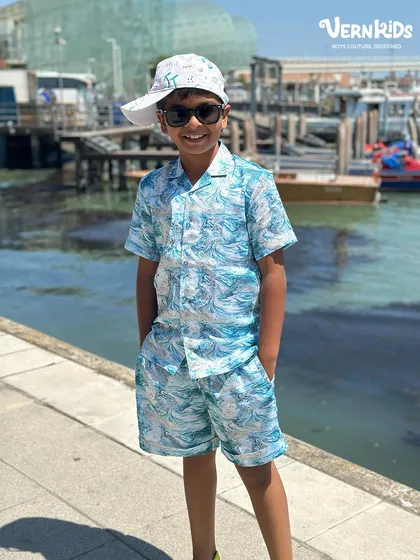 Style isn't just for parties. Our custom summer co-ord sets, like this blue marble print shirt and shorts, are made from light, breathable fabrics for ultimate comfort on vacation or a sunny day out.