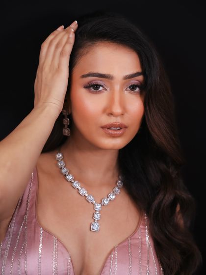 This close-up shows the flawless skin and soft eye makeup, perfect for a high-end event.