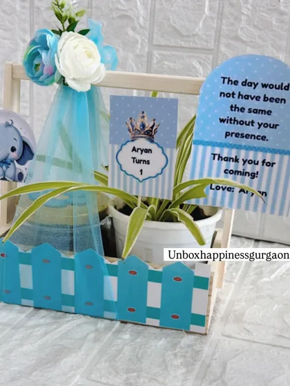 A beautifully composed shot of the blue-themed first birthday return gift, ready to be handed out to party guests.