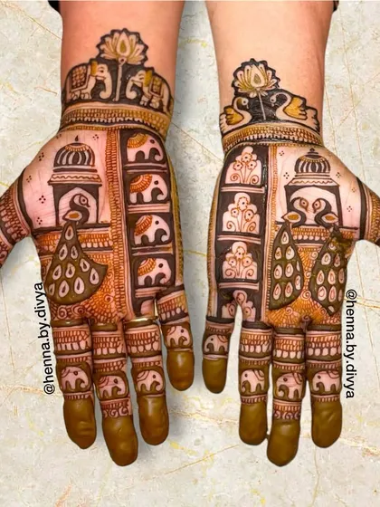 A design that heavily features peacocks and elephants arranged in vertical panels. This style is inspired by traditional Indian art and architecture.