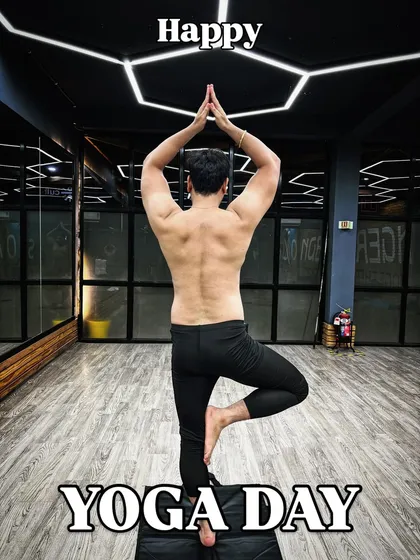 Fitness is a balance of strength and stillness. I incorporate yoga into my training programs to improve flexibility, prevent injuries, and build mental focus. Here I am in a Vrikshasana, or tree pose.