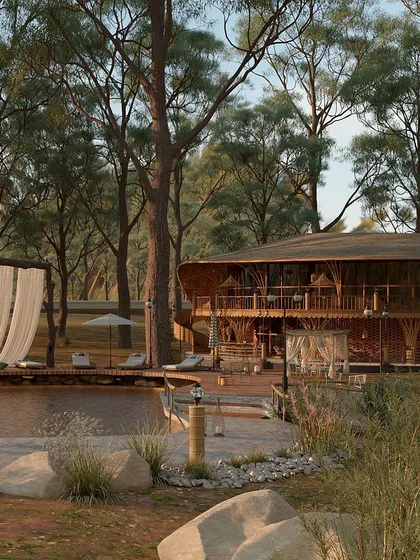 The main lodge and pool area are seen here, surrounded by the lush greenery of the property. The design emphasizes open-air living, with wide balconies and decks that invite guests to enjoy the natural setting from every vantage point.