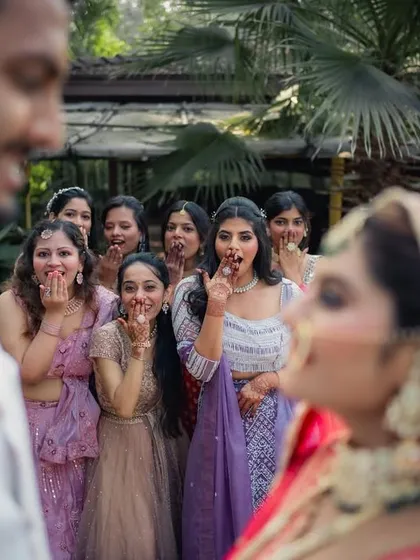 The bridesmaids' priceless reactions as they watch the couple's first look. A perfect candid moment full of surprise and joy.