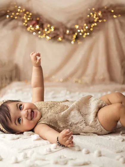 Sometimes the simplest moments are the most beautiful. This little sweetheart's happy giggle during her boho-themed sitter session is just pure love at first sight.