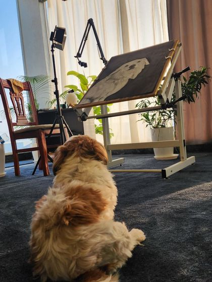 My furry supervisor keeping a close eye on the progress of this dog portrait.