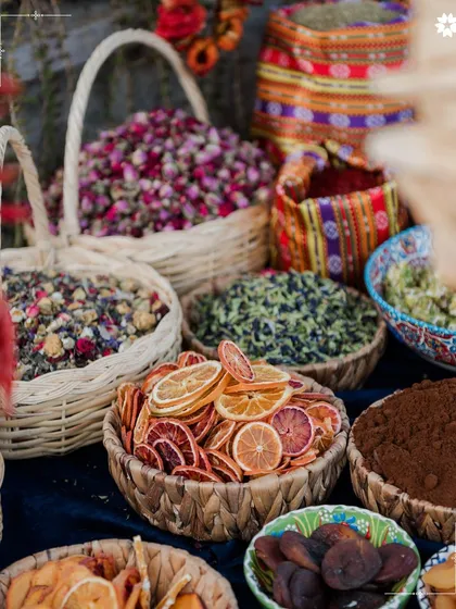 A closer look at the baskets of dried citrus and flower petals used in our Turkish market display. These details add texture, colour, and authenticity to the culinary setup.