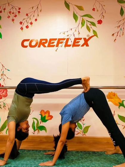 The double downward dog is a studio favorite. It's a fun way to deepen the classic pose, allowing for a greater stretch and a shared sense of accomplishment.