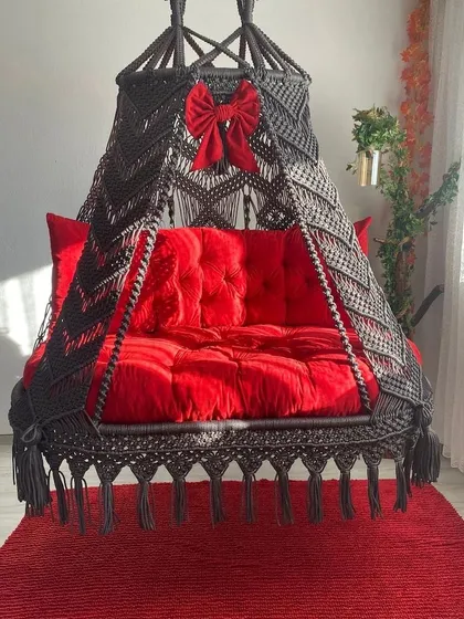 A classic combination of dark grey macrame with a vibrant red cushion. The little red bow is a custom touch we added for a client to make it extra special.