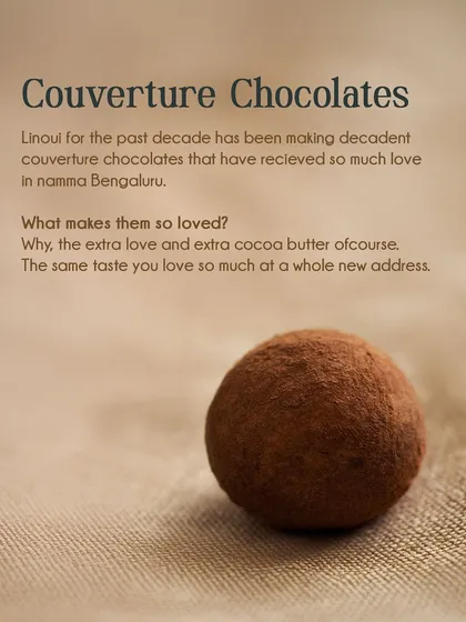 This image explains what makes our couverture chocolates so loved in namma Bengaluru: the extra love and extra cocoa butter. Pictured is a single, perfect cocoa-dusted truffle.