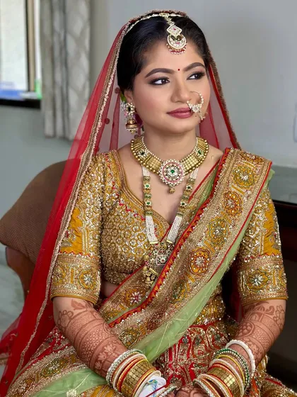 This traditional bridal makeover features a classic red and green lehenga. I balanced the vibrant colors with a soft yet defined makeup look, complete with a traditional nath for that perfect bridal touch.