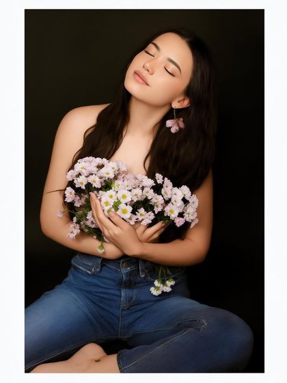 A serene portrait from the same floral series, with the model's eyes closed, conveying a sense of peace.