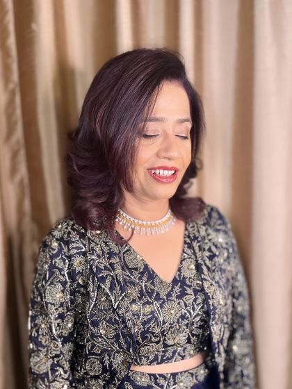 A close-up of her happy expression, with makeup that enhances her natural grace.