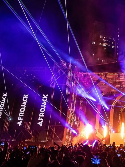 Lasers crisscross the sky at the Road to Ultra festival, featuring Afrojack. I partner with the world's biggest festival brands.