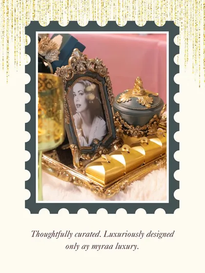 Thoughtfully curated, luxuriously designed. This image captures the essence of my brand, showcasing a vintage-style tray with an ornate photo frame, a decorative jar, and golden sweet boxes.