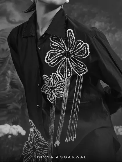 This black and white shot highlights the intricate pearl and beadwork on my Azalea shirt. The floral motifs with dangling tassels are designed to create texture and movement.