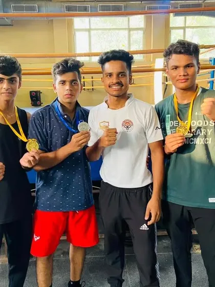 My coach with the CBSE tournament winners. My entire coaching staff is dedicated to our boxers' success.
