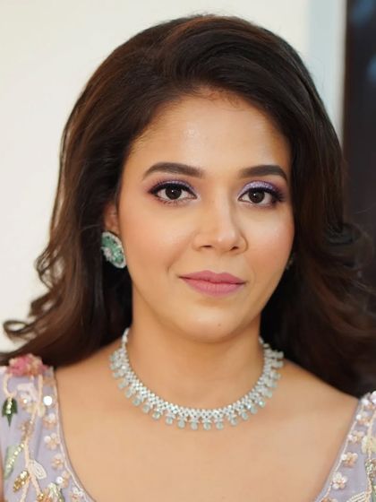 A beautiful, direct portrait of Nilofar, ready for her engagement. The soft lavender eye makeup and flawless skin create a look that is fresh, modern, and full of grace.