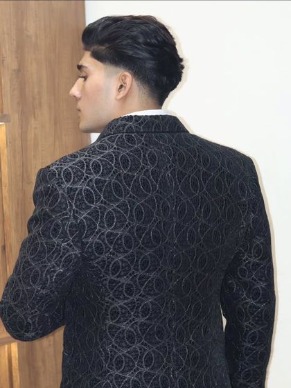 The back view of this patterned tuxedo jacket shows the precision of the fit and the quality of the fabric. Every detail is crafted to ensure you look sharp from every angle.