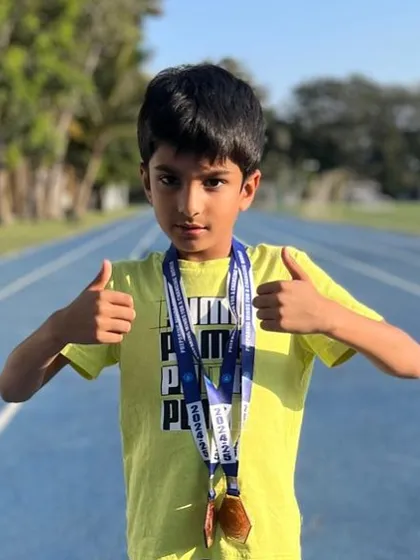 Thumbs up from Rishiv Khanna, who won a bronze medal in the 50 meters and a gold medal in the relay at the Jamnabai school sports day.