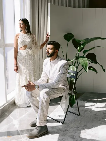 A modern, stylish portrait by the window. Their poses are confident and chic, creating a look that is both contemporary and timelessly cool.