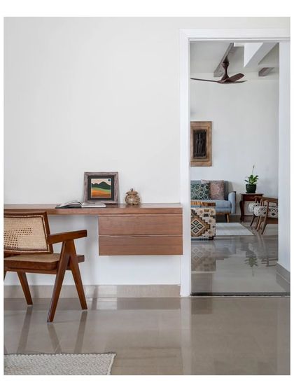 A view from the guest bedroom's study area, looking out into the main living space. The design ensures that even private corners of the home feel connected to the whole.