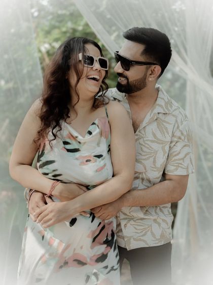A moment of shared laughter between a couple during their casual, outdoor shoot. Capturing genuine joy is what makes these photos so special.
