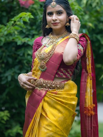 This yellow and red Kancheevaram silk saree is a classic and vibrant choice for brides and festive occasions.