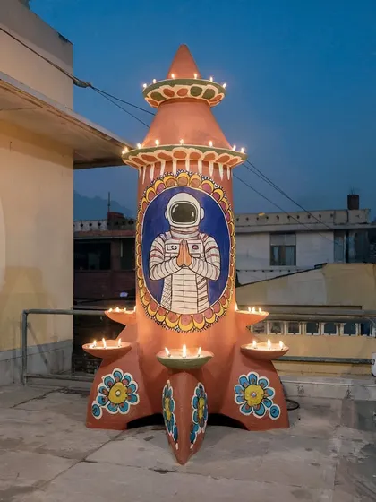 A rocket-shaped 'Jwālāsthal' or lamp-stand decorated for Diwali in 'Rocketganj'. This shows how the culture of the town adapts, blending religious tradition with the iconography of space travel.