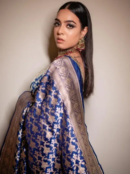 For the bride who loves drama, a bold look can be absolutely stunning. I created this deep blue smokey eye for Sonia's reception to complement her magnificent Banarasi saree. This is a perfect example of a full glam look that is both elegant and powerful.