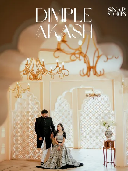 A wide shot of the couple in a luxurious, palace-like room with detailed archways and elegant decor, perfect for a grand and traditional pre-wedding theme.
