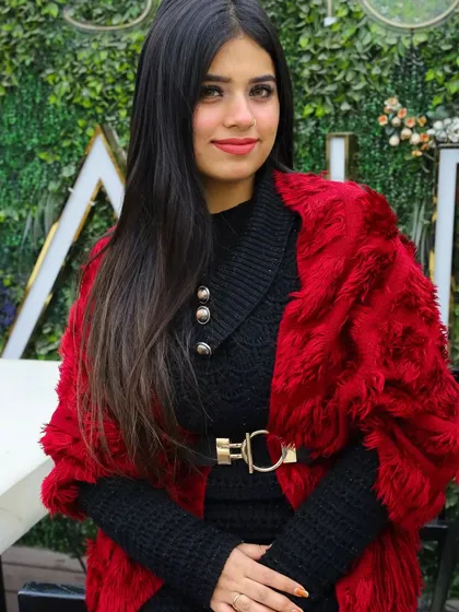 Kicking off a winter series shoot at a rooftop cafe. The combination of the cozy knit dress and the bold red faux fur wrap creates a perfect look for a chic, cold-weather portrait.