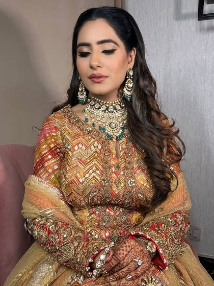 Eyes closed, this shot highlights the soft, blended eye makeup and the overall timeless beauty of the look.