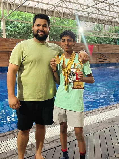 Here I am with a young champion who was named 'Best Swimmer' at the ICSE Meet. He achieved a clean sweep, winning 5 gold medals in 5 events and qualifying for the nationals.