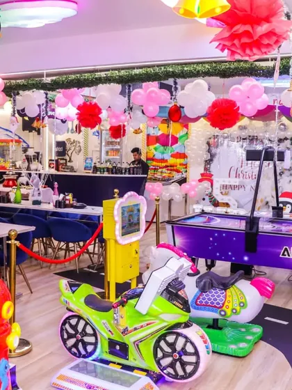 My East Delhi venue is more than just a play area; it's a full entertainment center. Here you can see our air hockey table, arcade games, and fun rides that keep both kids and adults engaged throughout the celebration.
