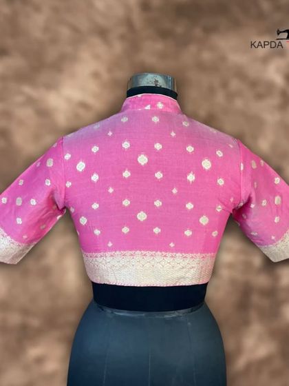 This Banarasi pink brocade blouse is a royal and traditional piece. The intricate brocade work and elegant zari embroidery give it a unique and timeless look, perfect for a wedding or sangeet.