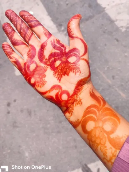 This shows the beautiful progression of my organic henna stain. The design starts with a bright orange and deepens into a rich, dark red over the next 48 hours.