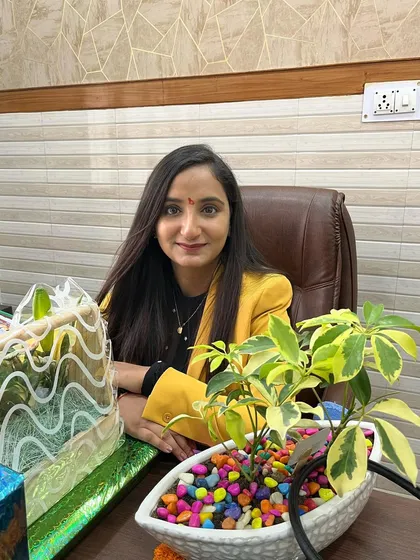 A photo of me, your consultant dermatologist, at my desk. I believe in a holistic and personalized approach to help you achieve your best skin health.
