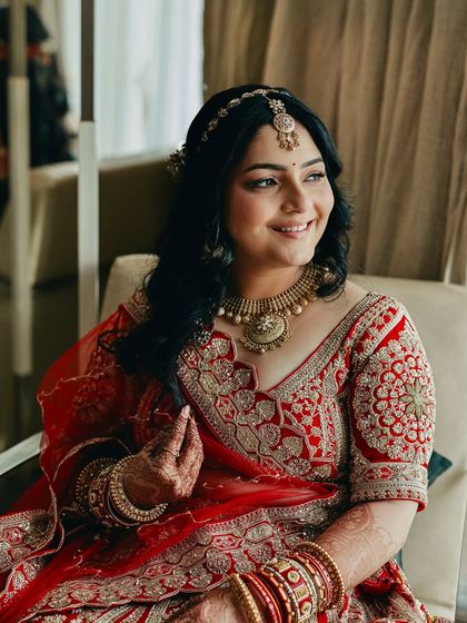 A close-up portrait of Shikha. You can see the details of her soft glam makeup, from the perfectly blended eyeshadow to the flawless skin.