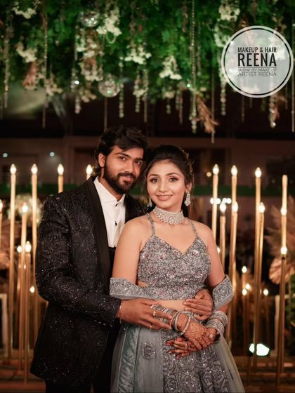 The happy couple at their sangeet. Aarjavi's sparkling grey lehenga and glamorous makeup were a perfect combination.