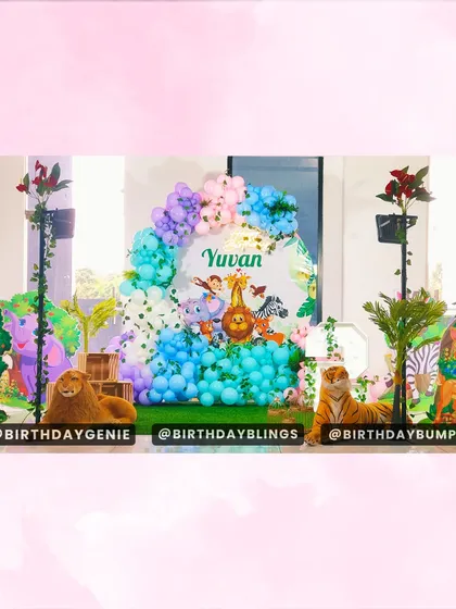 This colorful jungle theme brings together a variety of beloved animals for a fun and vibrant first birthday celebration. The setup includes character cutouts, a custom backdrop, and a mix of pastel and bright balloons.