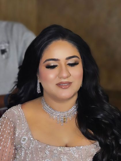 A close-up of the eye makeup. Soft, shimmery, and beautifully blended to make her eyes sparkle.