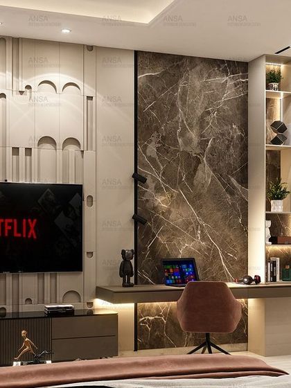 A different view of the bedroom with the 3D-paneled wall, showing how it cleverly incorporates a TV and a sleek, minimalist study desk. It's a perfect example of integrating function into a high-design concept.